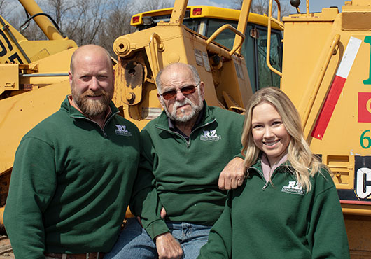 R.Z. Contracting Corporation’s Owner and President Ron Zawadsky (left) and Executive Vice President Katie Zawadsky (right) with Founder Ron Zawadsky Sr. 