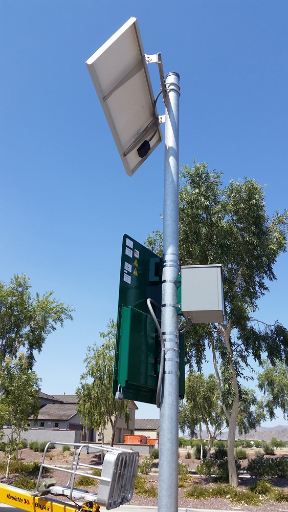 Solar panel powered sign mounting to the post.