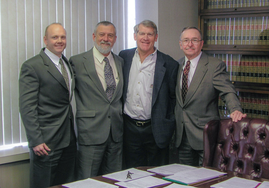 Left to right: Daniel Schmidtendorff and Barry Schleiger with original company owners, Vern McCain and Tibor Folding.